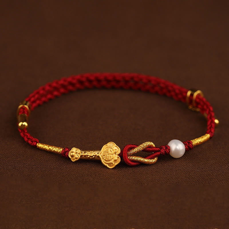 Bracelet porte-bonheur en or 24 carats avec fil rouge