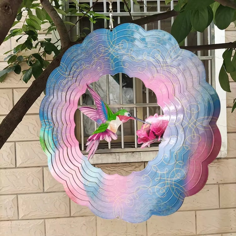 Metallic wind spinner suncatcher with hummingbird design in pink and blue iridescent colors