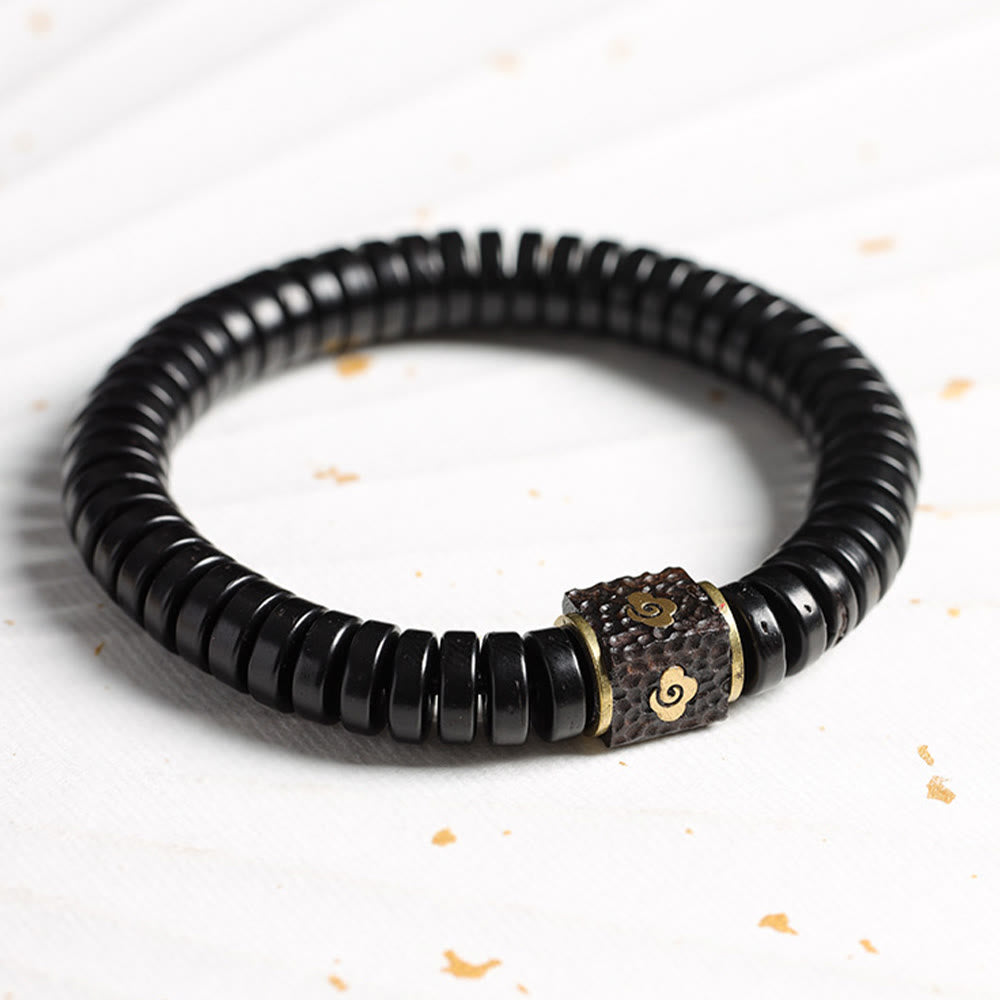 Bracelet en coquille de noix de coco 3x8 mm pour des intentions positives