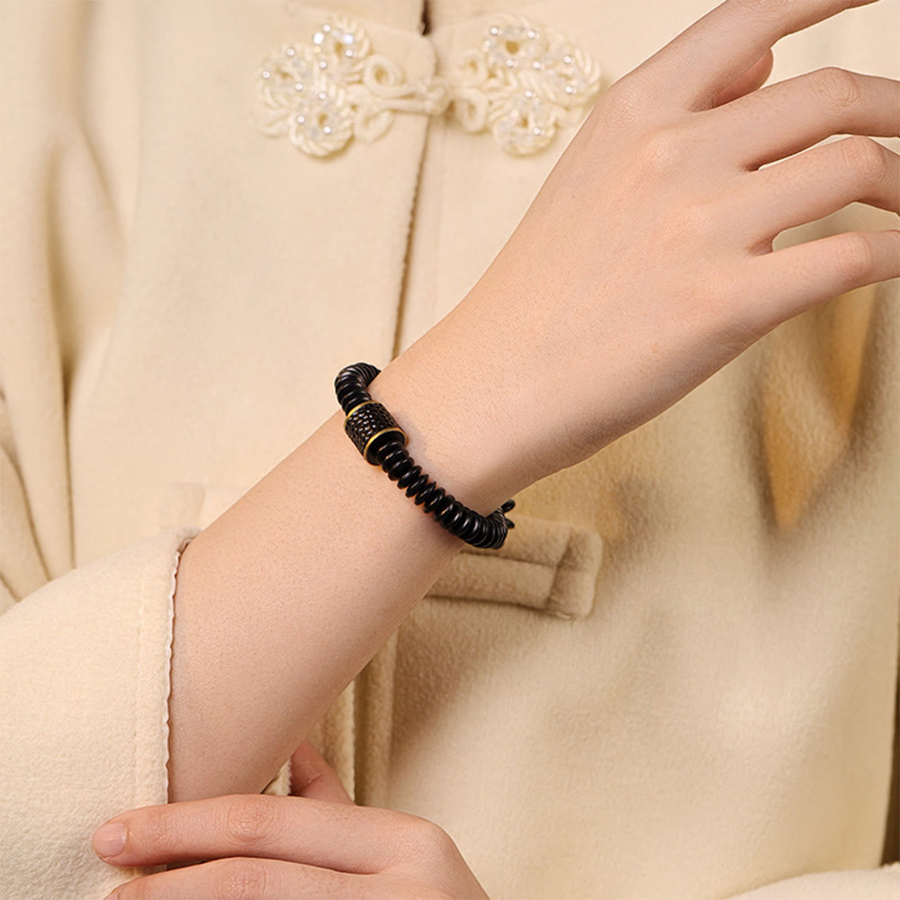 Bracelet en coquille de noix de coco 3x8 mm pour des intentions positives