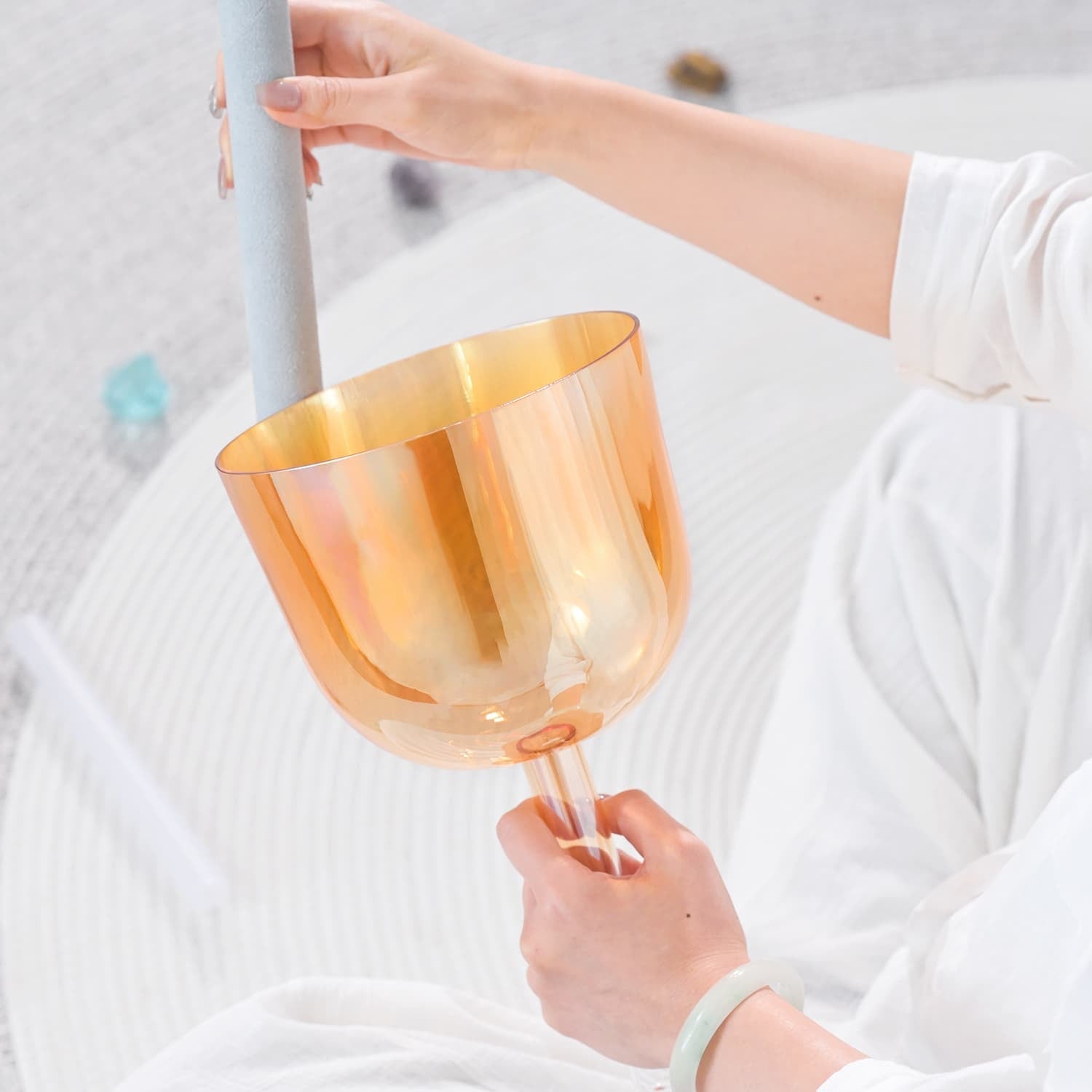 Peach-colored translucent wine glass with tulip-shaped bowl for sound healing