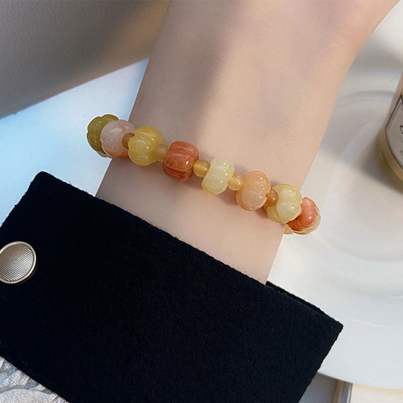 Bracelet en jade doré et soie 6x8 mm pour la richesse et la chance