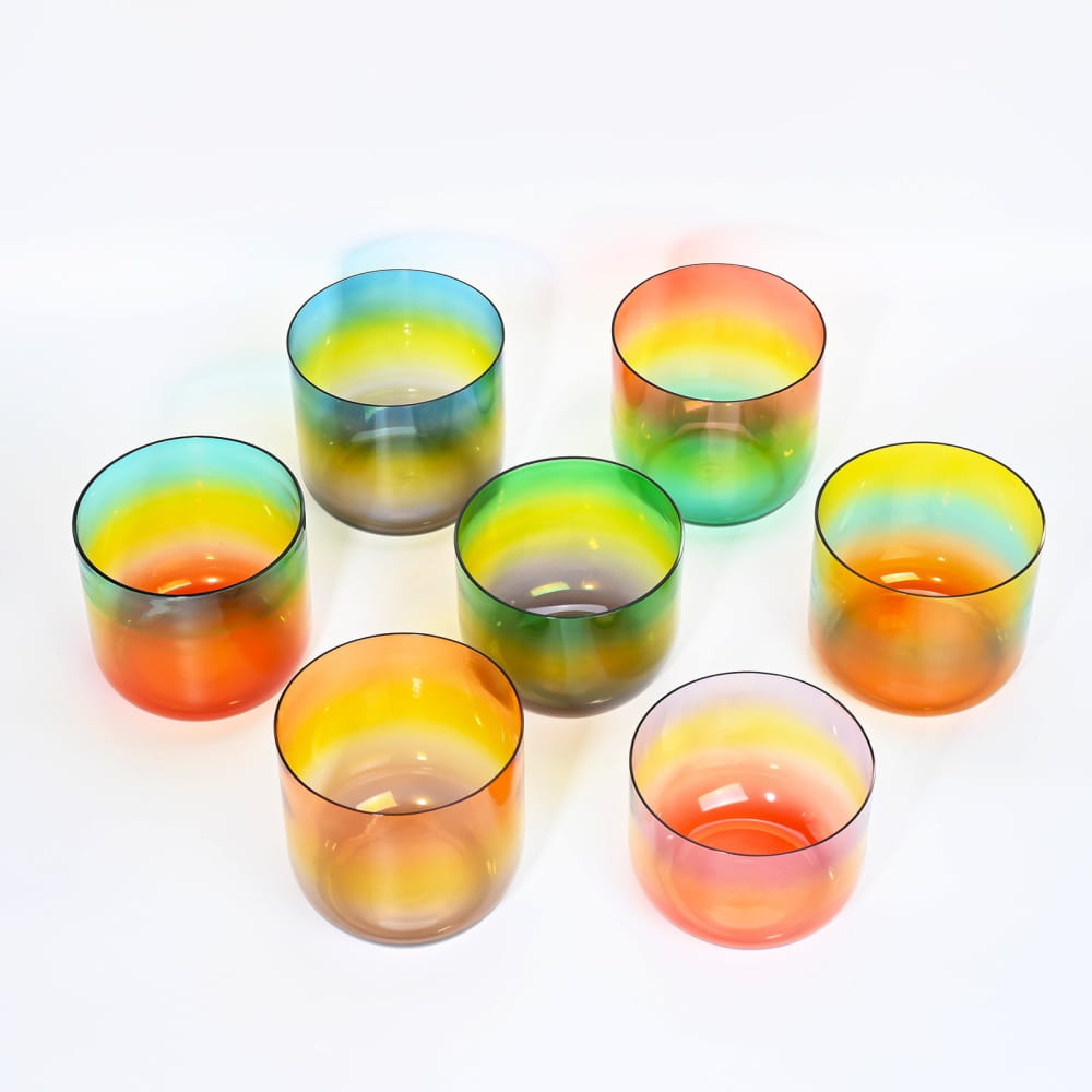 Colorful gradient glass cups in a circular pattern for Alchemy Clear Rainbow set