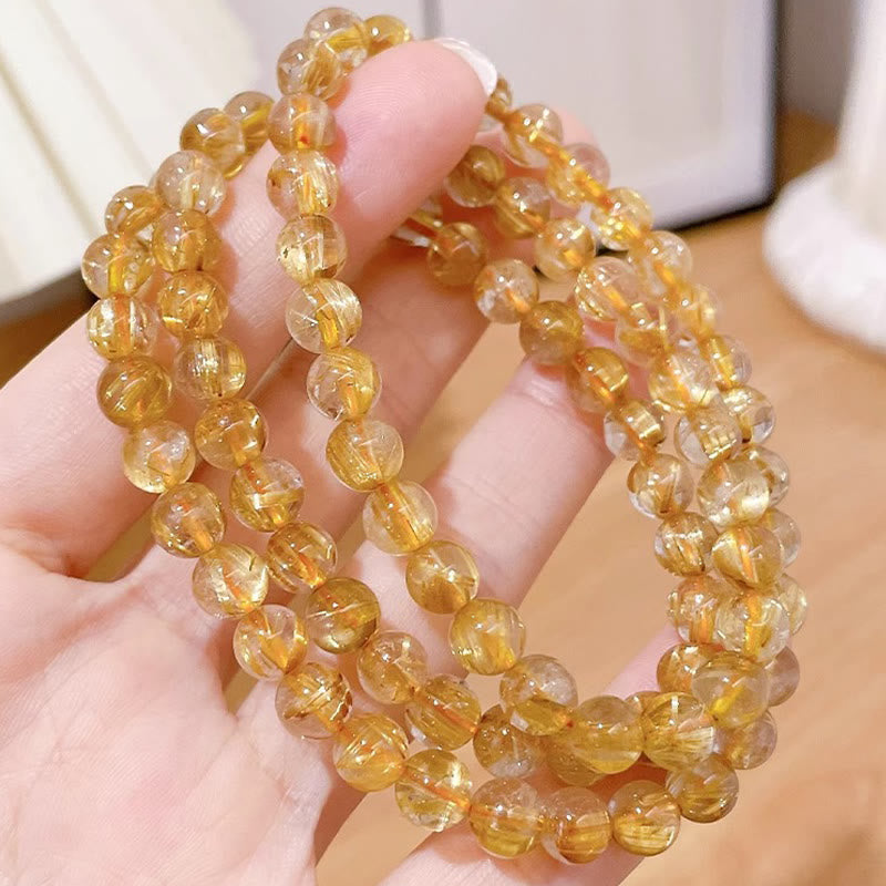 Bracelet de richesse en quartz rutile doré de 7 mm avec pierre de soleil et cyanite