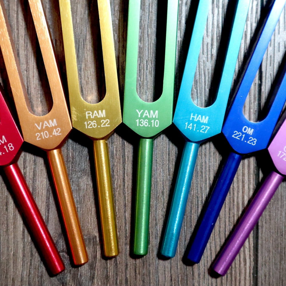 Colorful tuning forks in a rainbow pattern for Chakra alignment and sound therapy