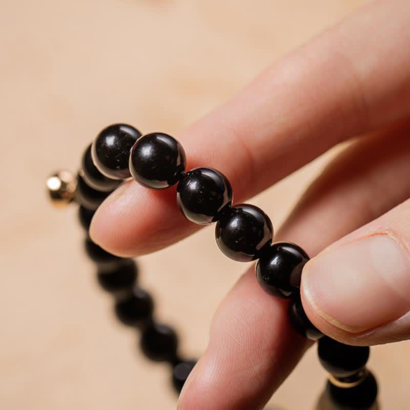 Bracelet de force Om Mani Padme Hum en jade obsidienne noire de 8 mm