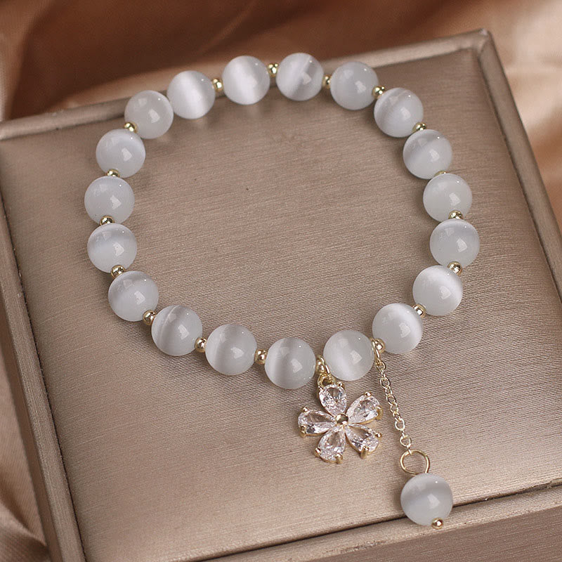 Bracelet à breloques œil de chat 8 mm avec fleur de paix et de soutien
