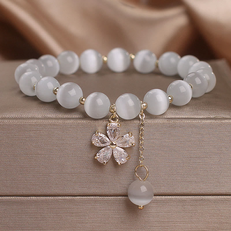 Bracelet à breloques œil de chat 8 mm avec fleur de paix et de soutien