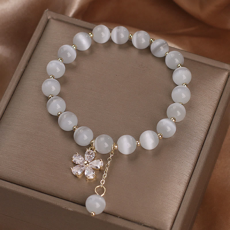 Bracelet à breloques œil de chat 8 mm avec fleur de paix et de soutien