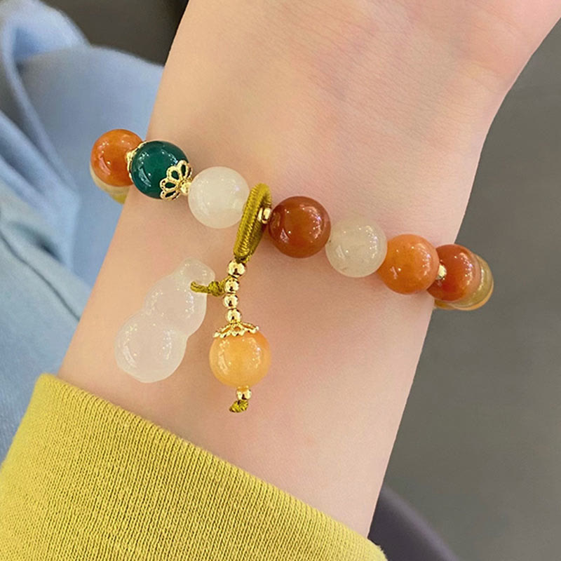 Bracelet en jade de soie dorée de 8 mm pour la richesse et la chance