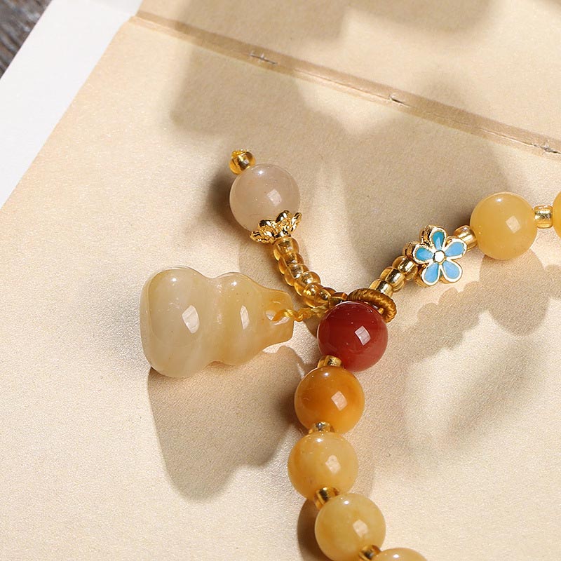 Bracelet porte-bonheur en jade et soie dorée de 8 mm