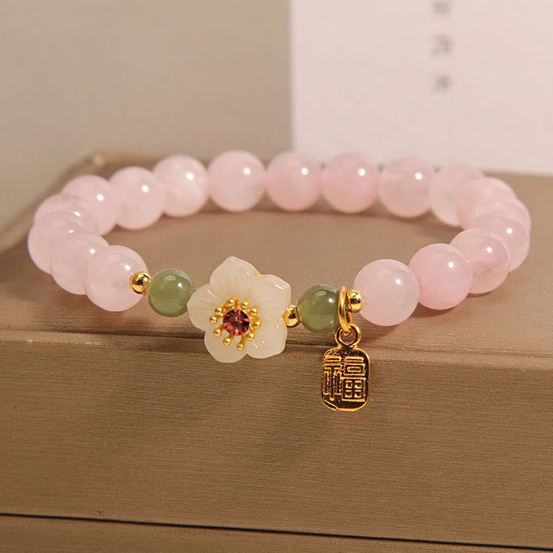 Bracelet de relation Fu en quartz rose 8 mm avec fleur de pêcher