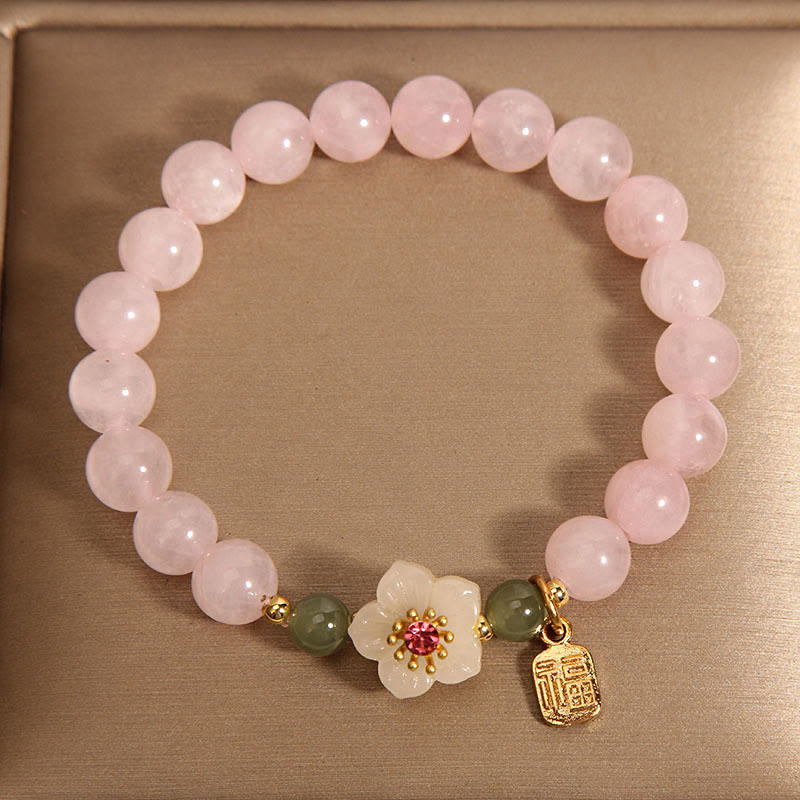 Bracelet de relation Fu en quartz rose 8 mm avec fleur de pêcher