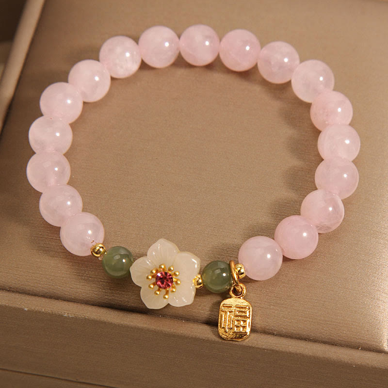 Bracelet de relation Fu en quartz rose 8 mm avec fleur de pêcher