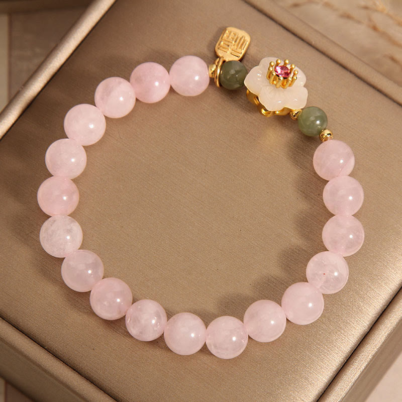 Bracelet de relation Fu en quartz rose 8 mm avec fleur de pêcher