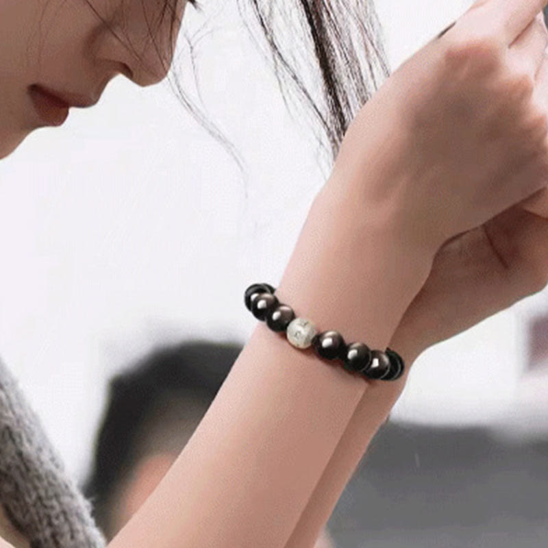 Bracelet Om Mani Padme Hum en obsidienne argentée brillante de 8 mm