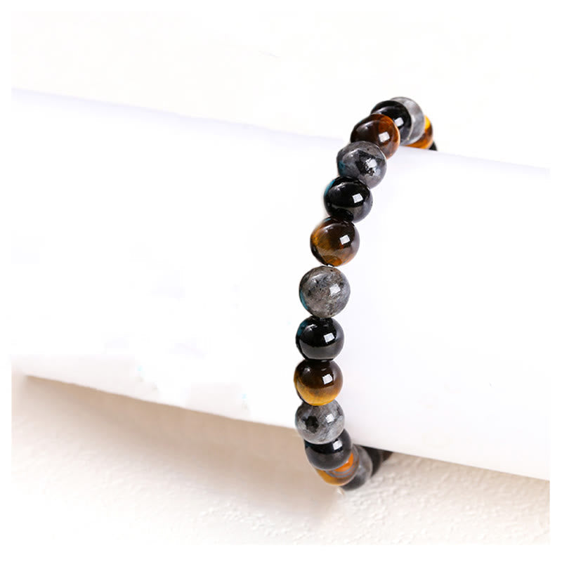 Bracelet de protection œil de tigre 8 mm avec pierres scintillantes noires
