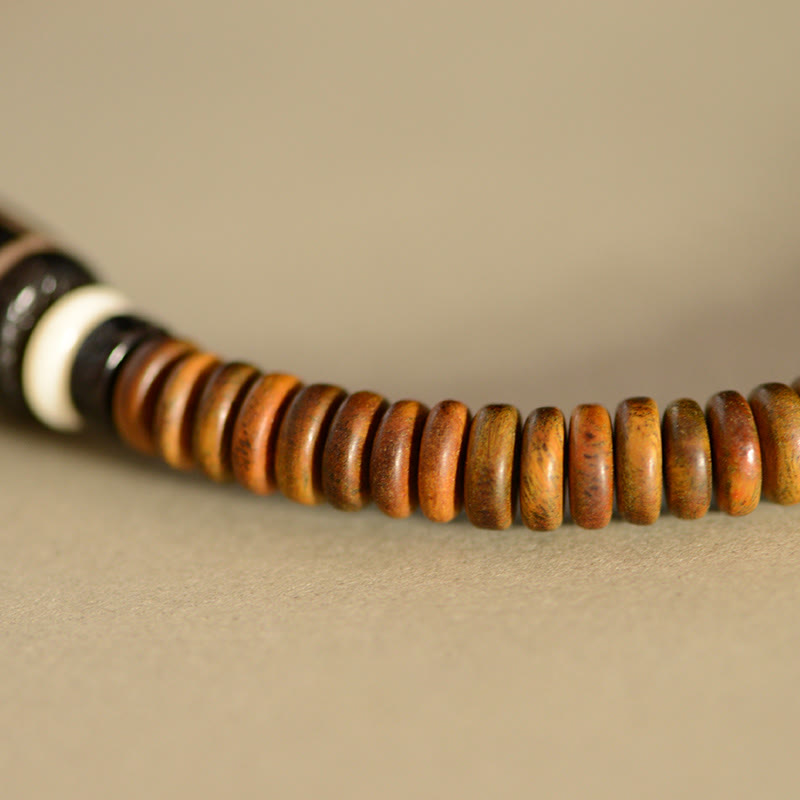 Bracelet spirituel double tour en bois d'ébène et perles Dzi à 9 œillets