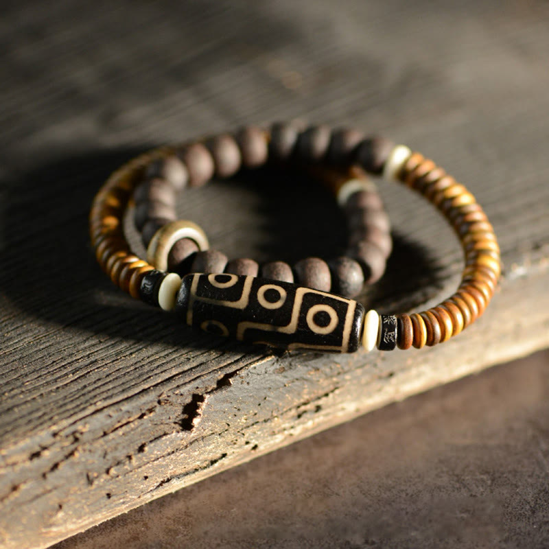 Bracelet spirituel double tour en bois d'ébène et perles Dzi à 9 œillets