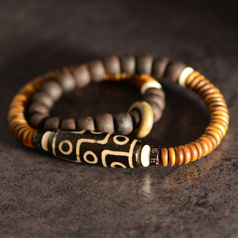 Bracelet spirituel double tour en bois d'ébène et perles Dzi à 9 œillets