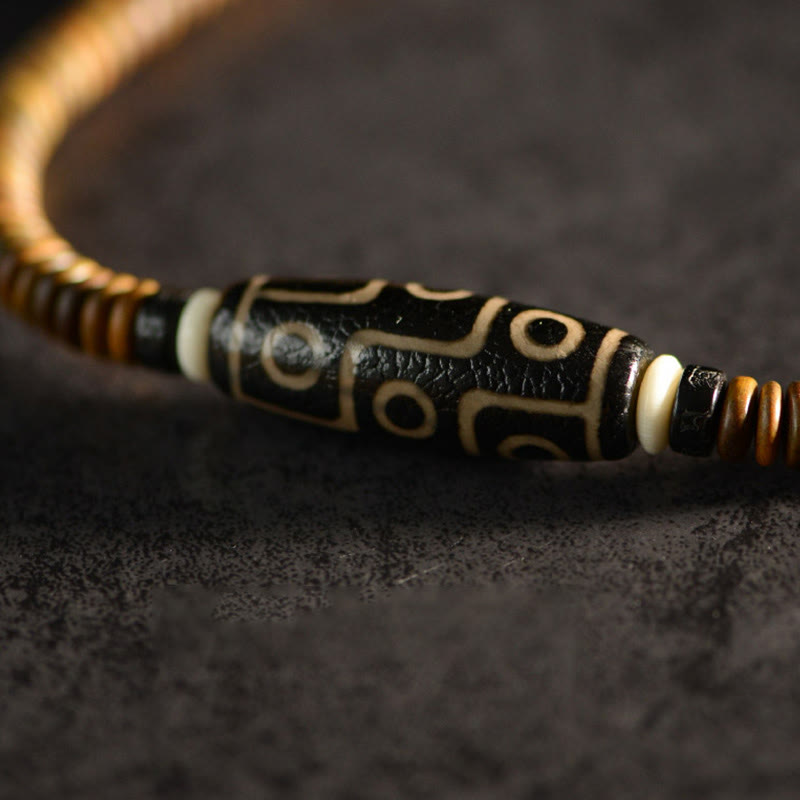 Bracelet spirituel double tour en bois d'ébène et perles Dzi à 9 œillets