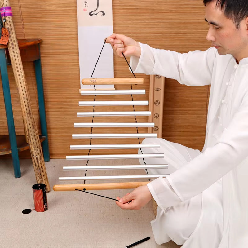 Hanging xylophone with white bars and black strings for Yoga Sound Therapy