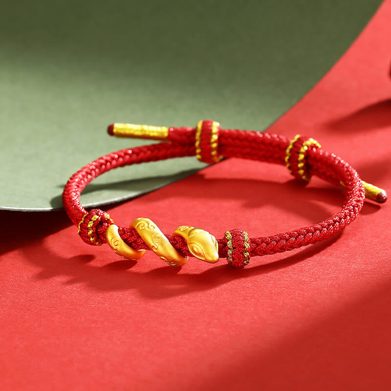 Bracelet de protection serpent en or 999 et fil rouge