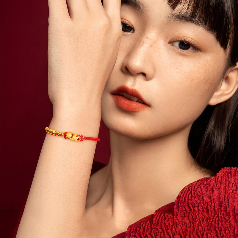 Bracelet porte-bonheur serpent en or 999 avec fil rouge