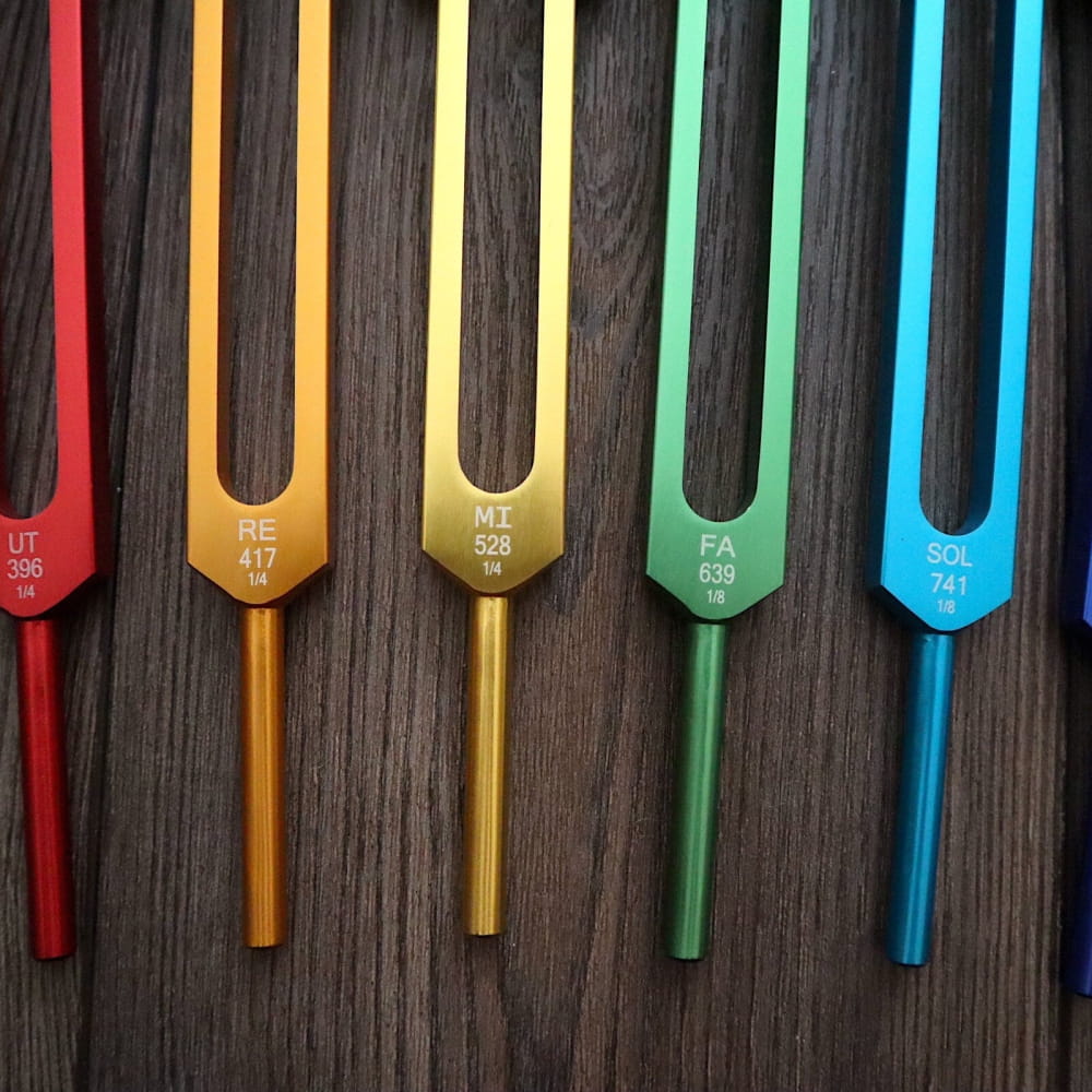 Colorful tuning forks in rainbow spectrum for 9pc Solfeggio Tuning Fork Set