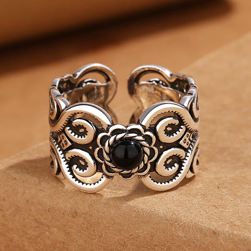 Bague porte-bonheur réglable en onyx noir avec bande en cuivre