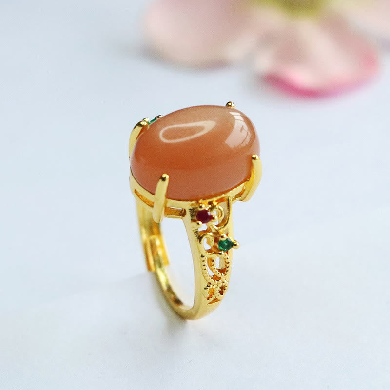 Bague ajustable en pierre de lune pêche - Joie et créativité