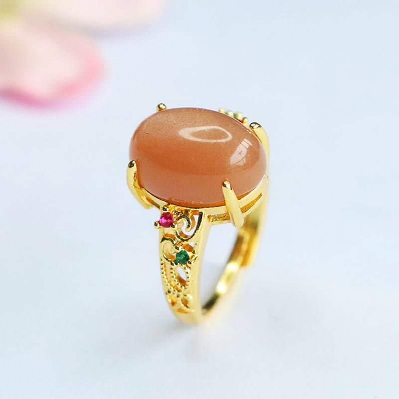 Bague ajustable en pierre de lune pêche - Joie et créativité