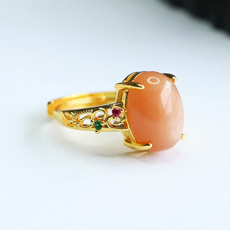 Bague ajustable en pierre de lune pêche - Joie et créativité
