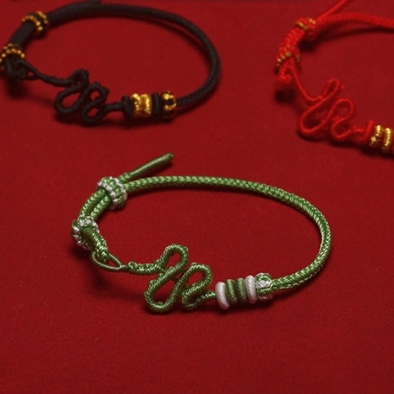 Bracelet de protection réglable en corde rouge avec nœud de serpent