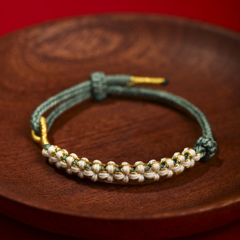 Bracelet tibétain réglable en fil d'or rouge avec nœud en fleur de pêcher