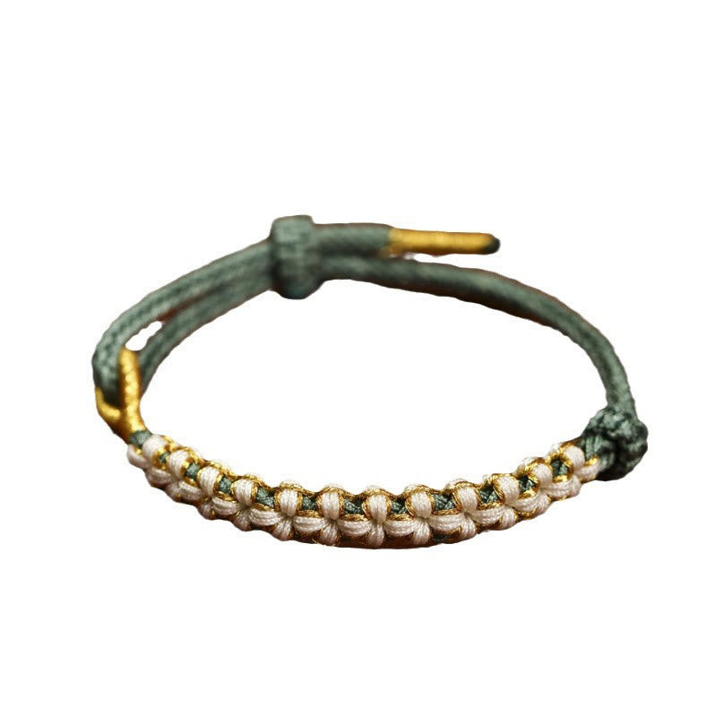 Bracelet tibétain réglable en fil d'or rouge avec nœud en fleur de pêcher