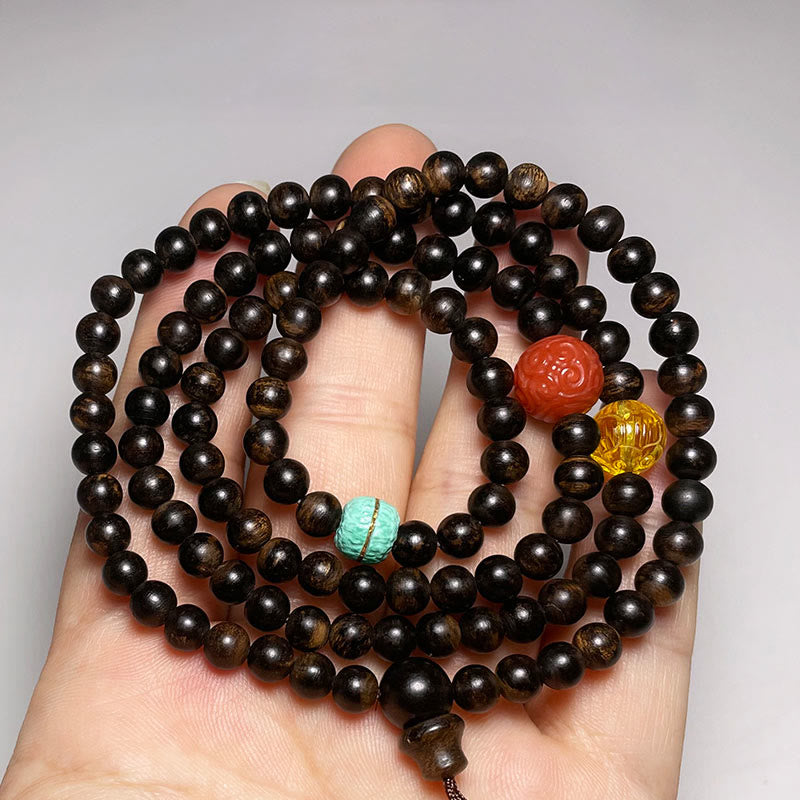Bracelet en bois d'agar avec ambre turquoise et agate rouge pour la force