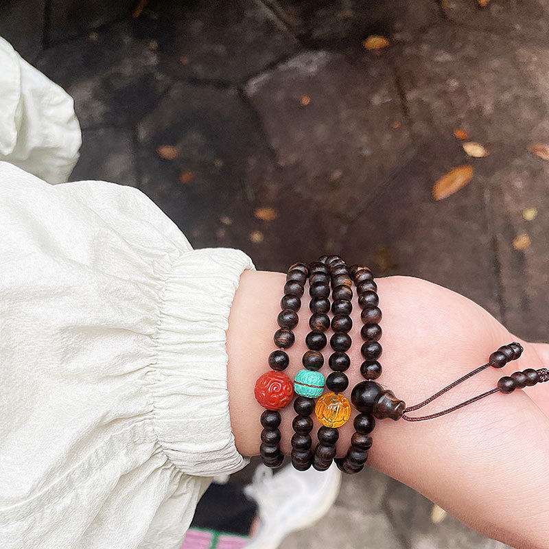 Bracelet en bois d'agar avec ambre turquoise et agate rouge pour la force