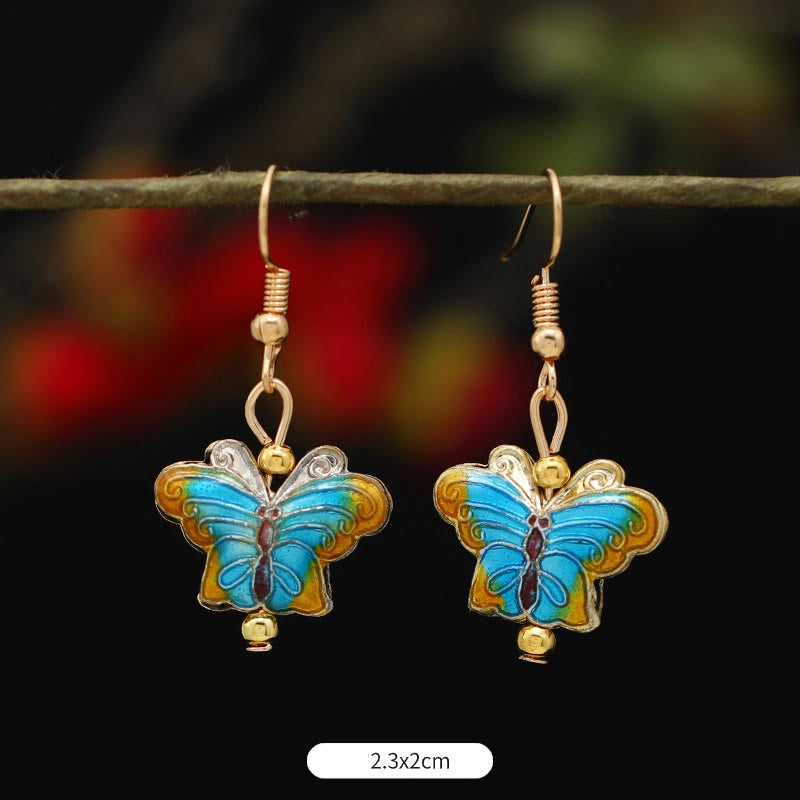 Boucles d'oreilles pendantes en alliage de cuivre et papillon lotus pour l'éveil spirituel