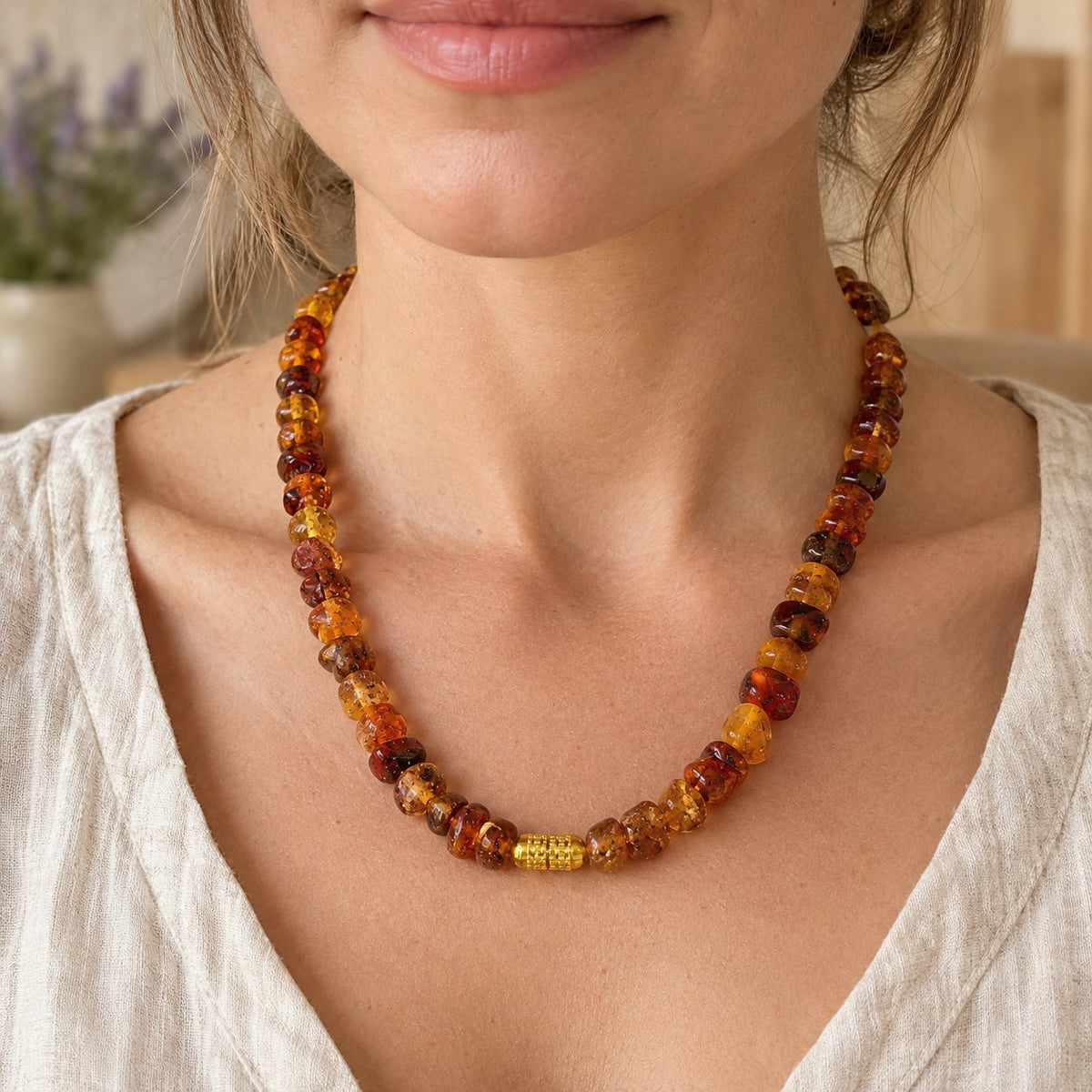 7-10mm Amber Chips Spiritual Healing Necklace, worn on the neck by a woman