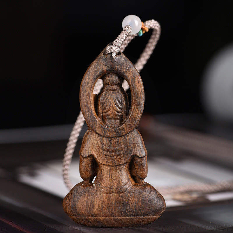 Collier pendentif paix en bois d'agar d'Avalokitesvara