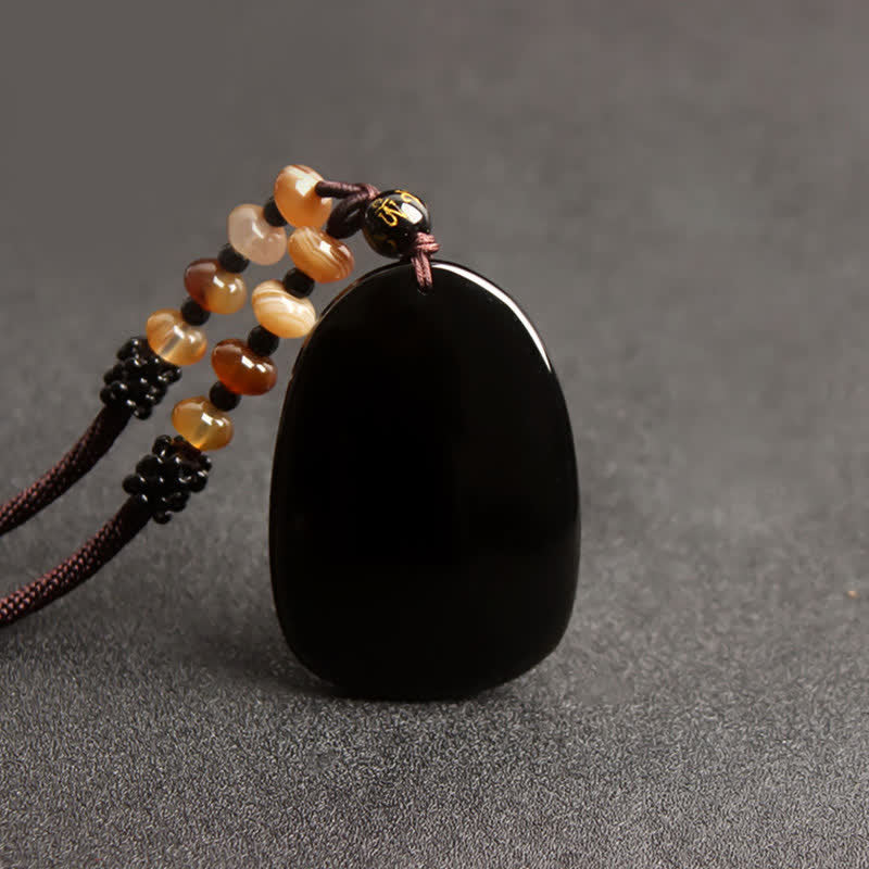 Collier dragon en obsidienne noire avec pendentif œil de tigre pour la protection