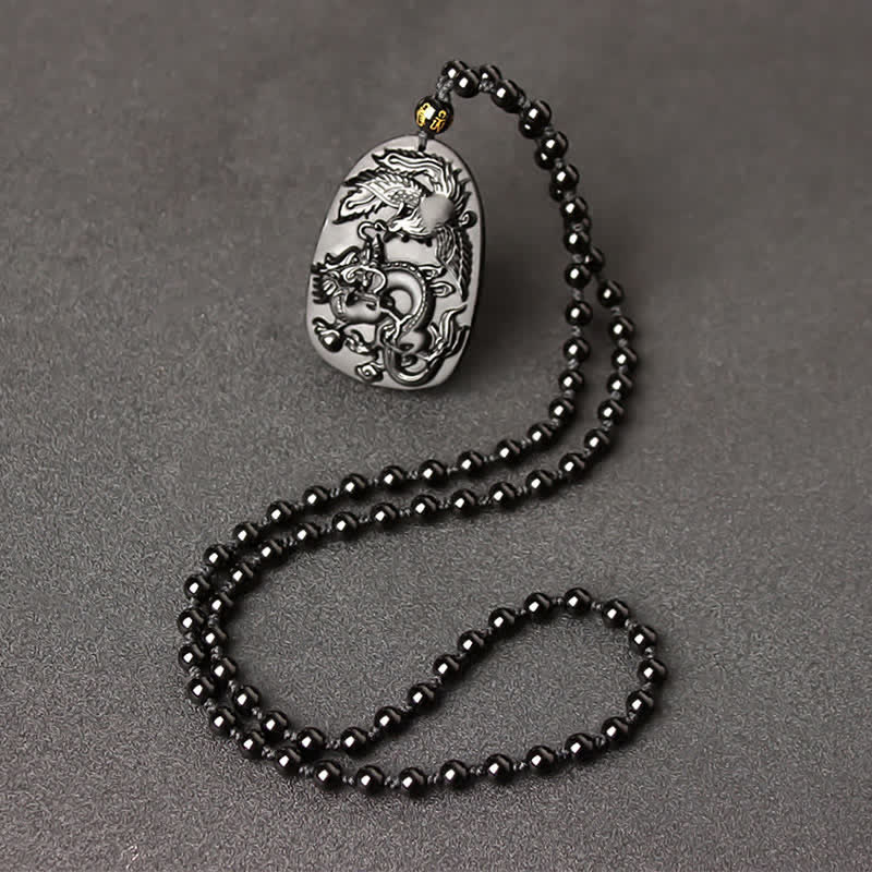Collier dragon en obsidienne noire avec pendentif œil de tigre pour la protection