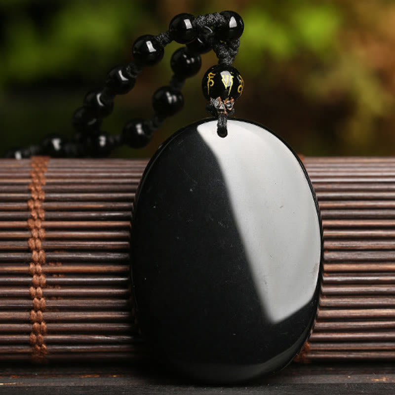 Collier pendentif poisson koï en obsidienne noire pour la force et l'épanouissement