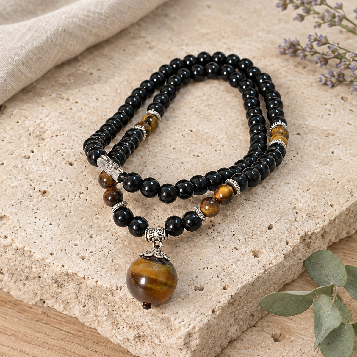 Black Obsidian Tiger Eye Necklace for Protection & Strength, necklace doubled in a shell dish