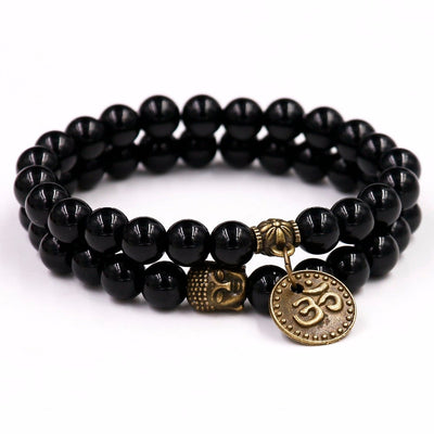 Bracelet symbole Om en onyx noir avec breloque Bouddha