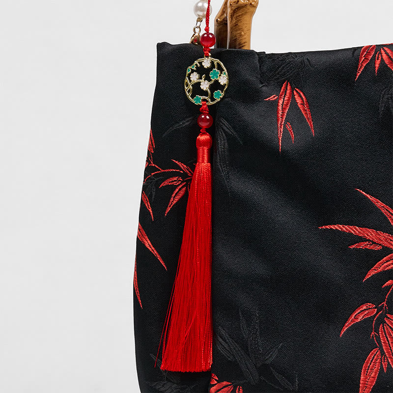 Sac en polyester et coton noir brodé de feuilles avec poignée en bambou