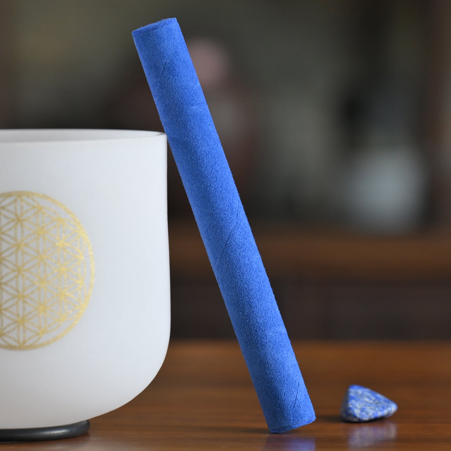 Blue chalk stick beside a white bowl with yellow design for Blue Suede Mallet