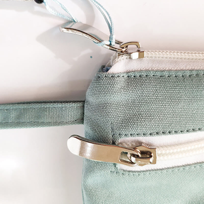 Portefeuille en toile avec broderie grue prune cerise | Compact 21 x 13 cm