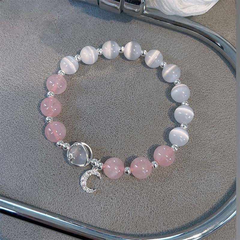 Bracelet spirituel avec breloque lune et cristal rose œil de chat